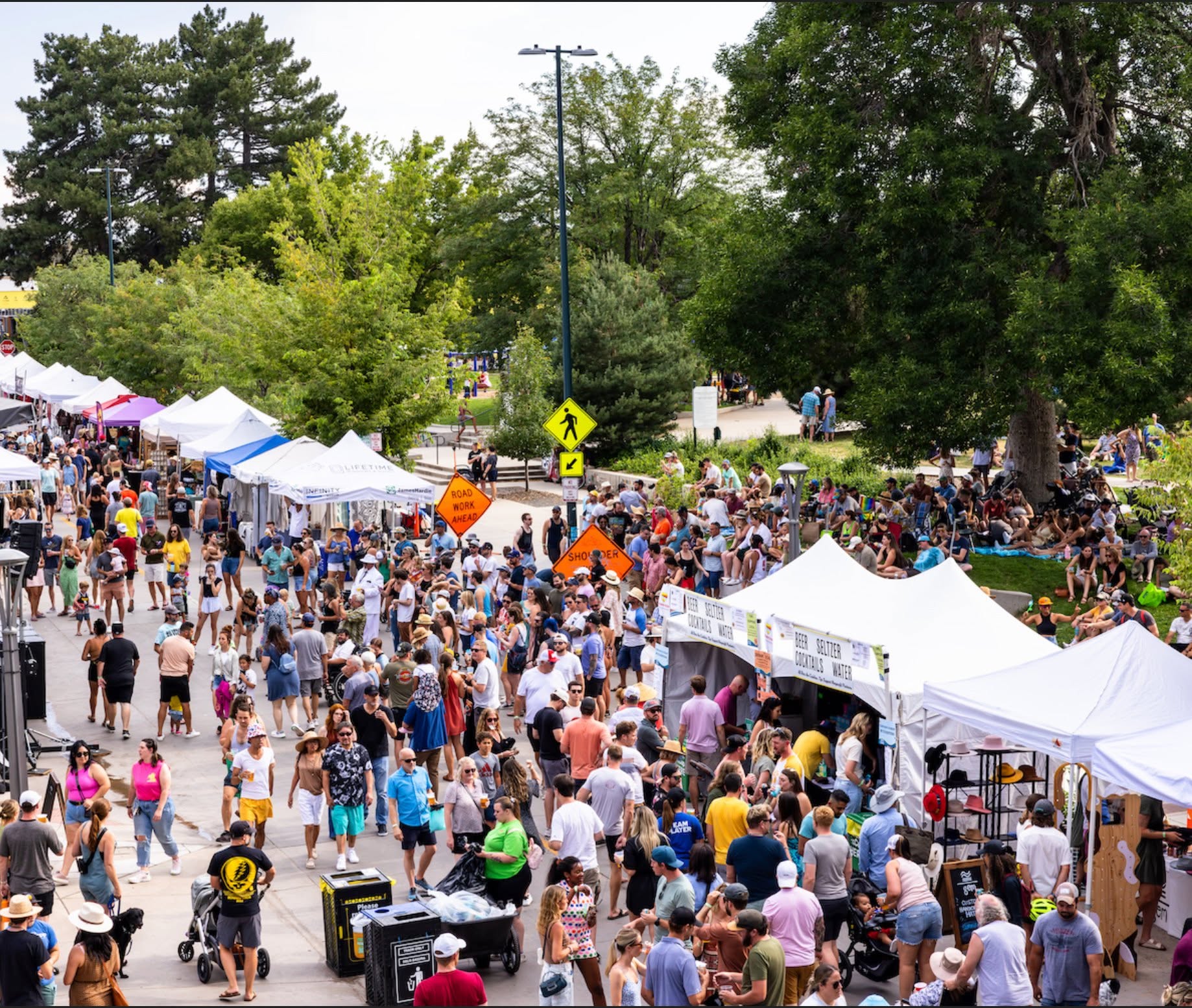 Packed street festival crowd where Taste of Texas BBQ vends